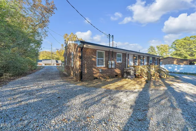 a view of a house with basketball court
