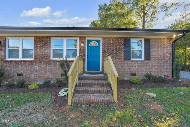 front view of a house with a yard
