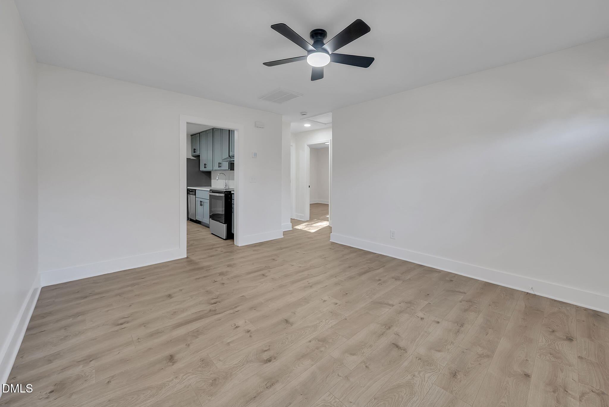 510 East Branch Street Spring Hope, NC 27882 - Photo 6 of 32 a view of a kitchen with a sink and a refrigerator