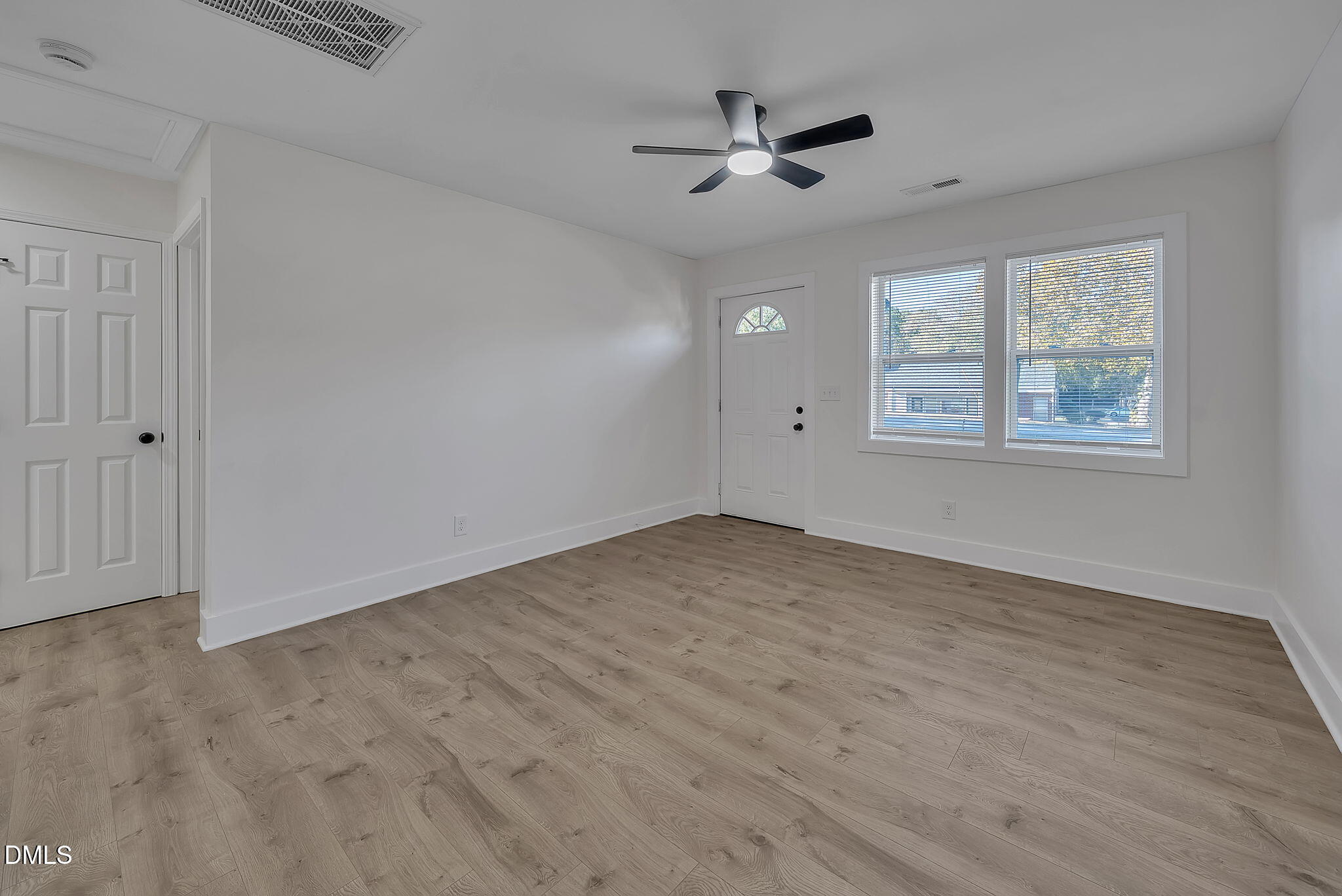 510 East Branch Street Spring Hope, NC 27882 - Photo 7 of 32 wooden floor in an empty room with a window