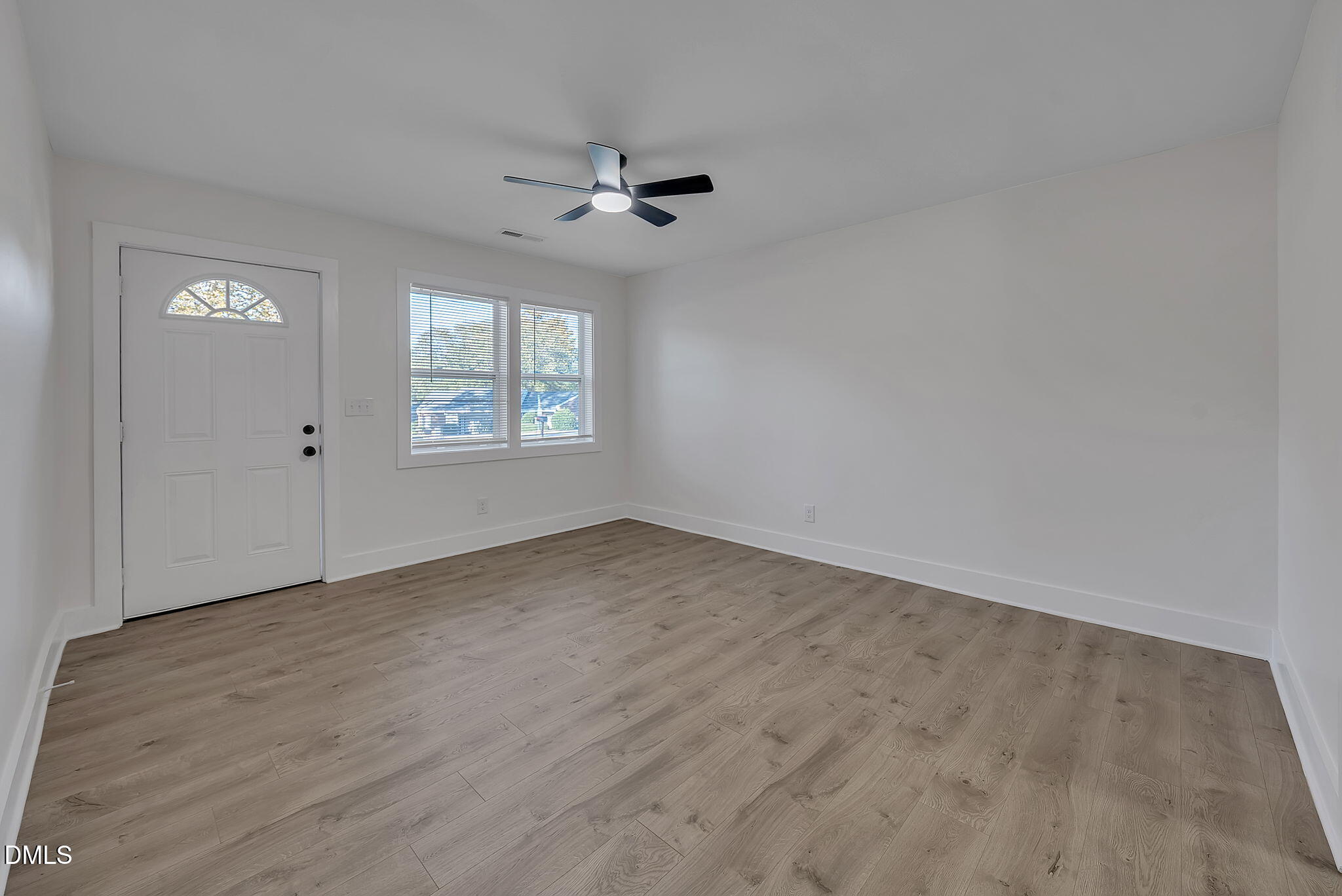 510 East Branch Street Spring Hope, NC 27882 - Photo 8 of 32 wooden floor in an empty room with a window