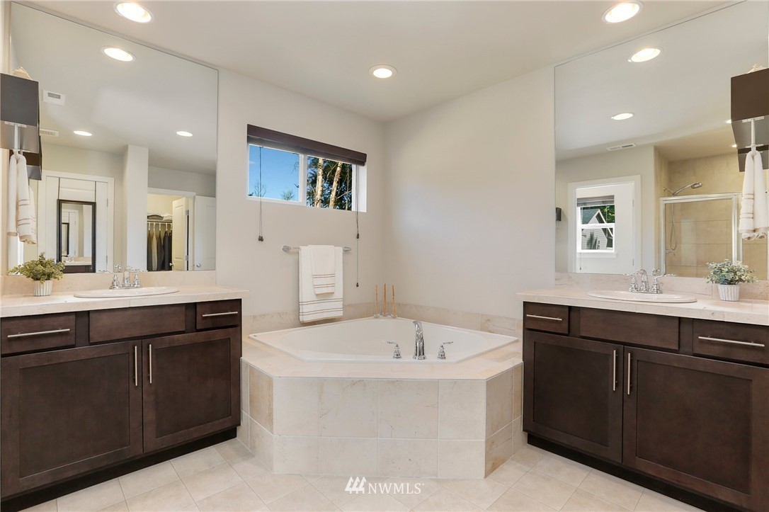16211 5th Avenue Southeast Bothell, WA 98012 - Photo 22 of 36 a spacious bathroom with a bathtub sink and mirror