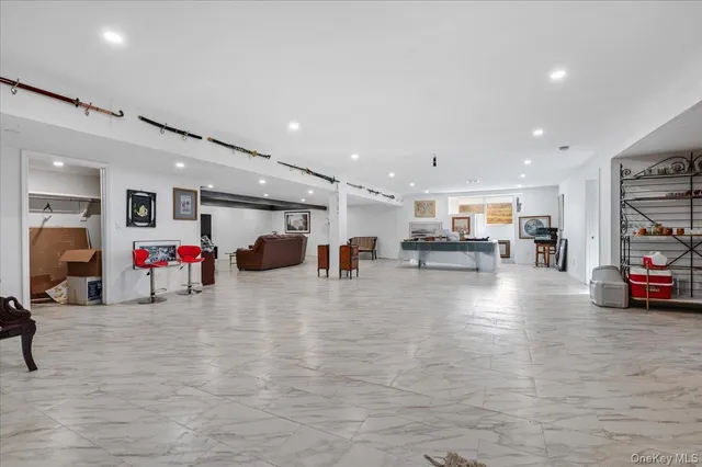 a room with lots of furniture and white equipment