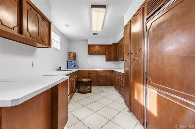 a kitchen with stainless steel appliances a sink stove and cabinets