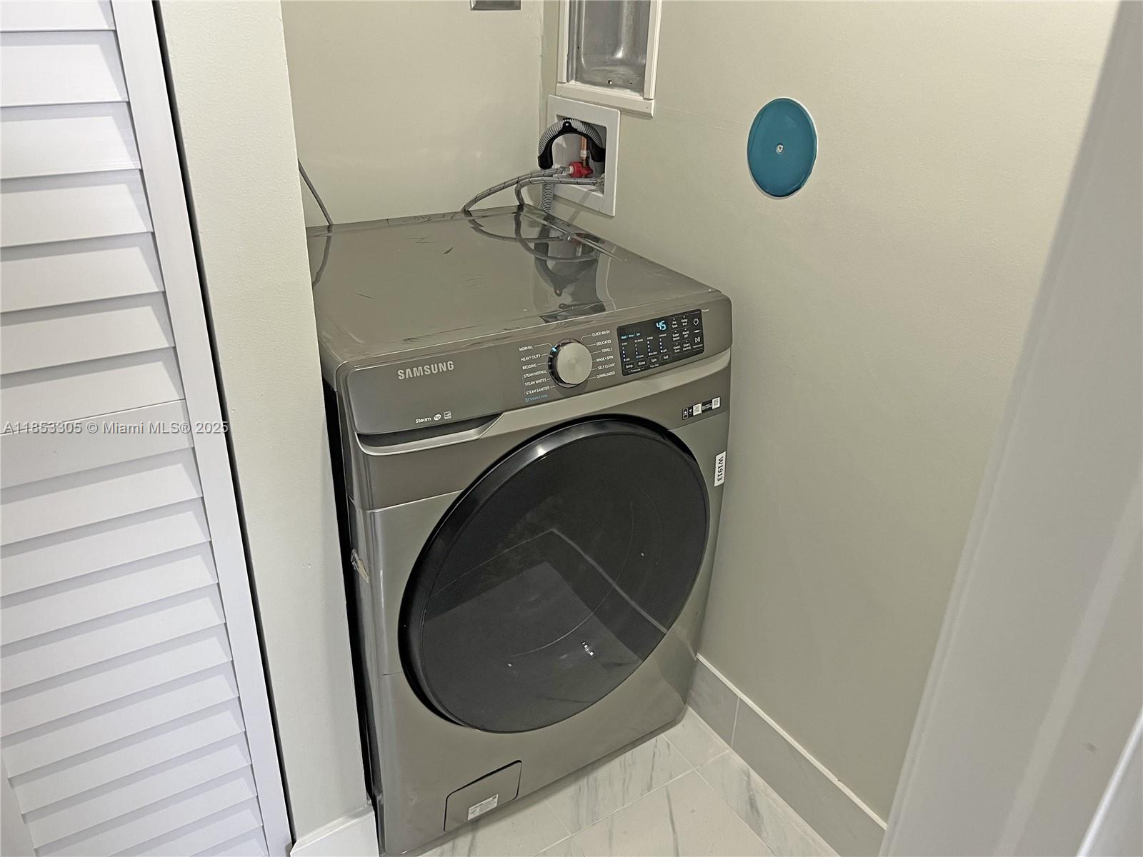 1331 Southwest 124th Court, Unit E3 Miami, FL 33184 - Photo 14 of 17 a utility room with dryer and washer