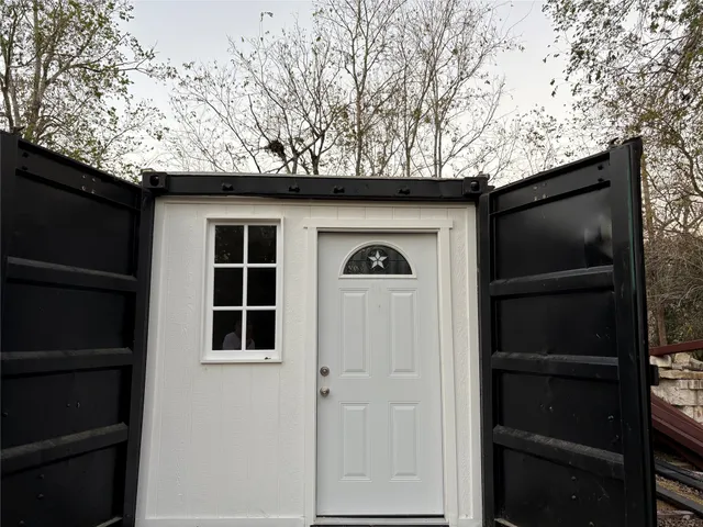 a house with a tree in the background