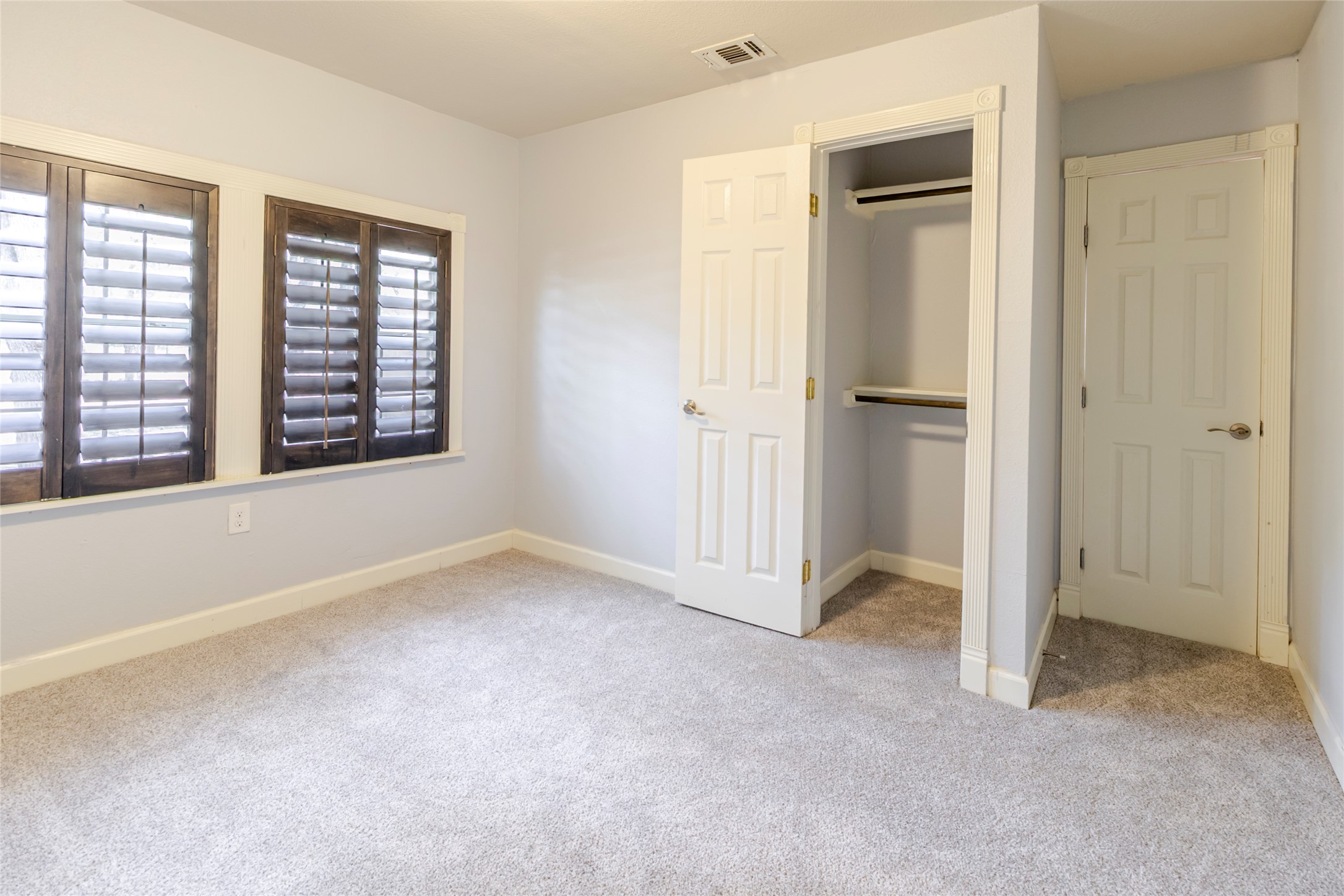4459 Pettytown Road Dale, TX 78616 - Photo 16 of 30 an empty room with windows and closet