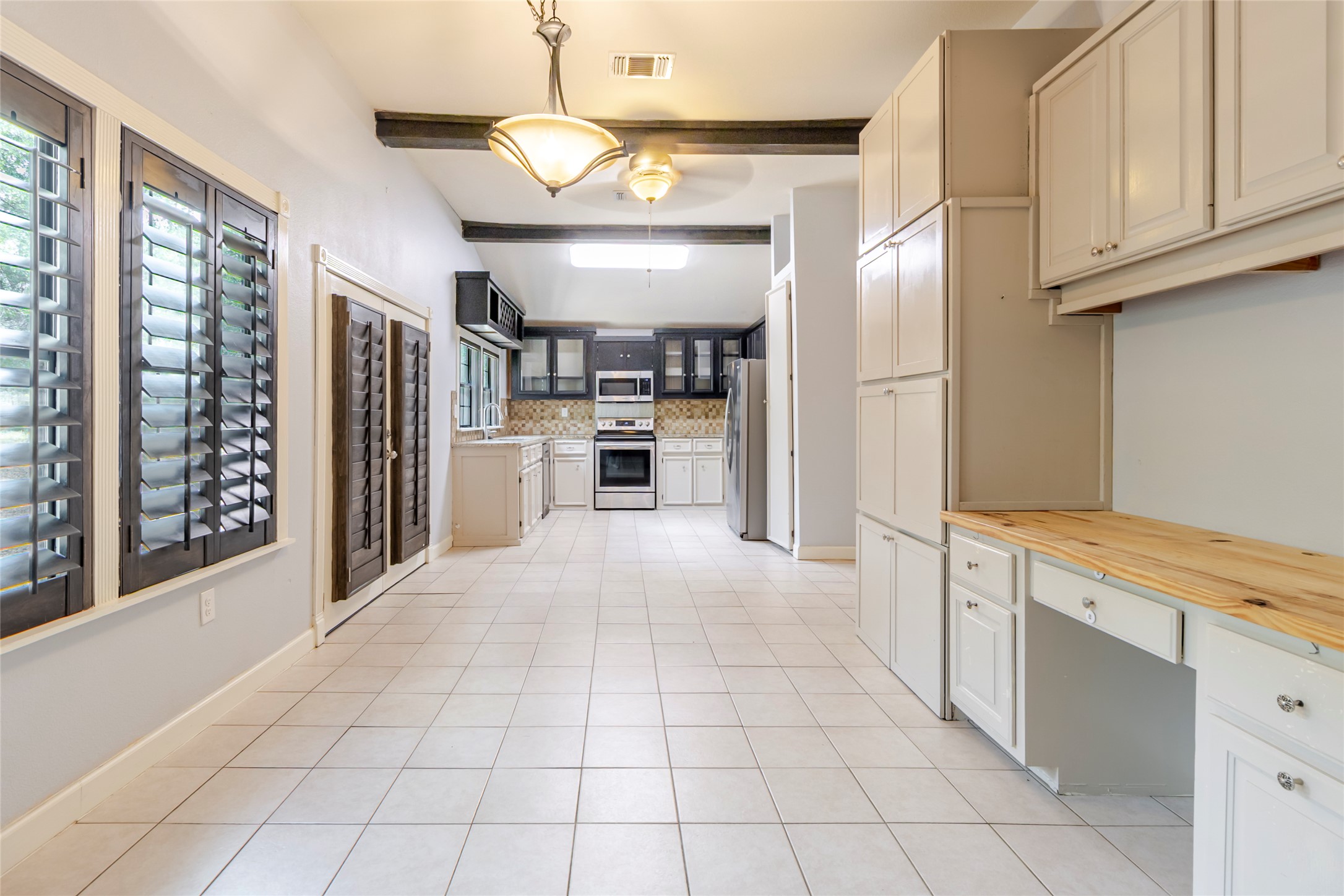 4459 Pettytown Road Dale, TX 78616 - Photo 19 of 30 a open kitchen with cabinets and stainless steel appliances