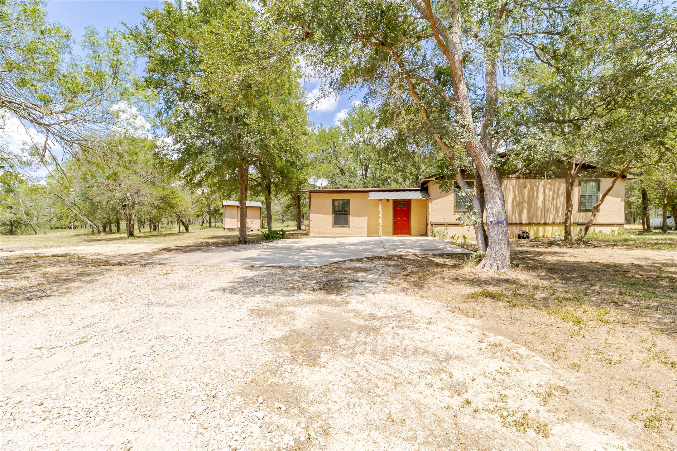 4459 Pettytown Road Dale, TX 78616 - Photo 2 of 30 a view of a house with snow on the road