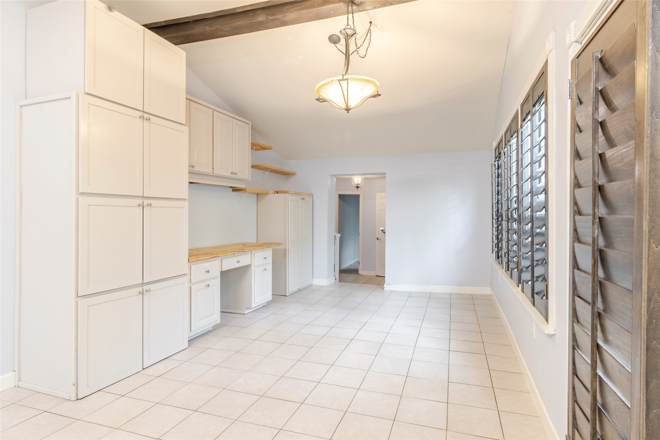 4459 Pettytown Road Dale, TX 78616 - Photo 21 of 30 a view of a kitchen with white cabinets and entryway