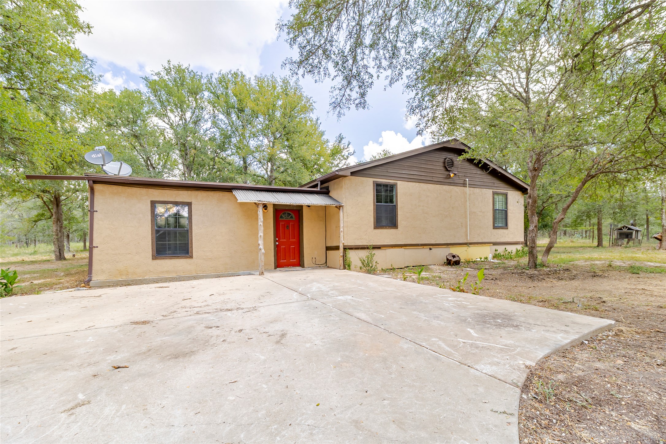 4459 Pettytown Road Dale, TX 78616 - Photo 3 of 30 a front view of a house with a yard and garage