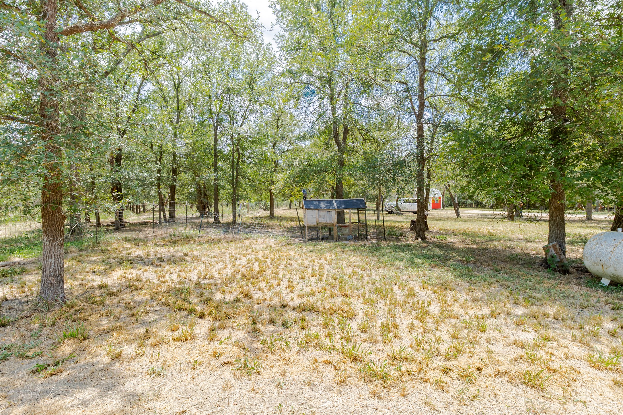 4459 Pettytown Road Dale, TX 78616 - Photo 6 of 30 a view of outdoor space with deck and trees