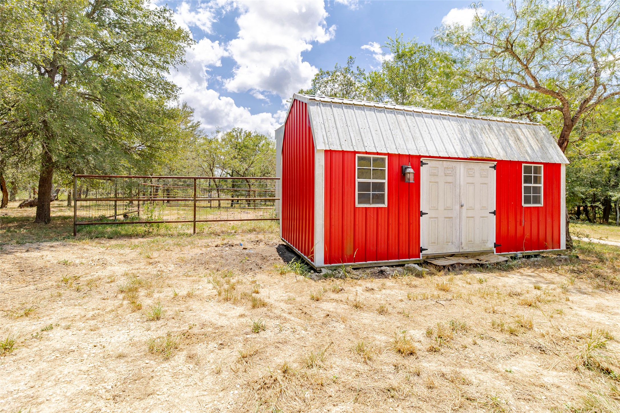 4459 Pettytown Road Dale, TX 78616 - Photo 9 of 30 a view of a backyard with a barn