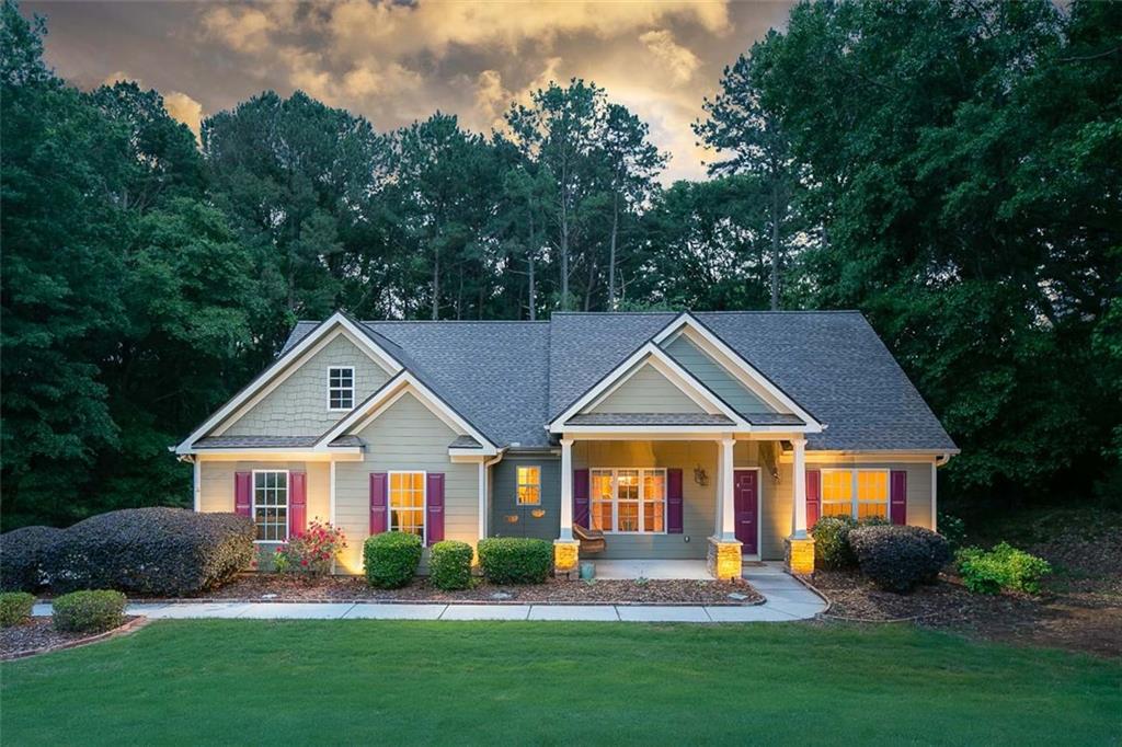 2881 Gratis Road Monroe, GA 30656 - Photo 1 of 1 a front view of a house with a yard and trees