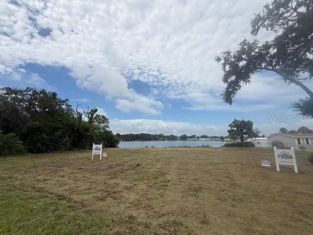 3131 Spirit Lake Road Winter Haven, FL 33880 - Photo 1 of 2 a view of a lake with houses in back