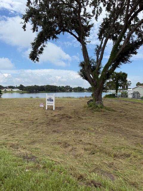 3131 Spirit Lake Road Winter Haven, FL 33880 - Photo 2 of 2 a view of a lake with houses in the back