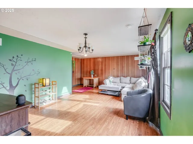 a living room with furniture and a table