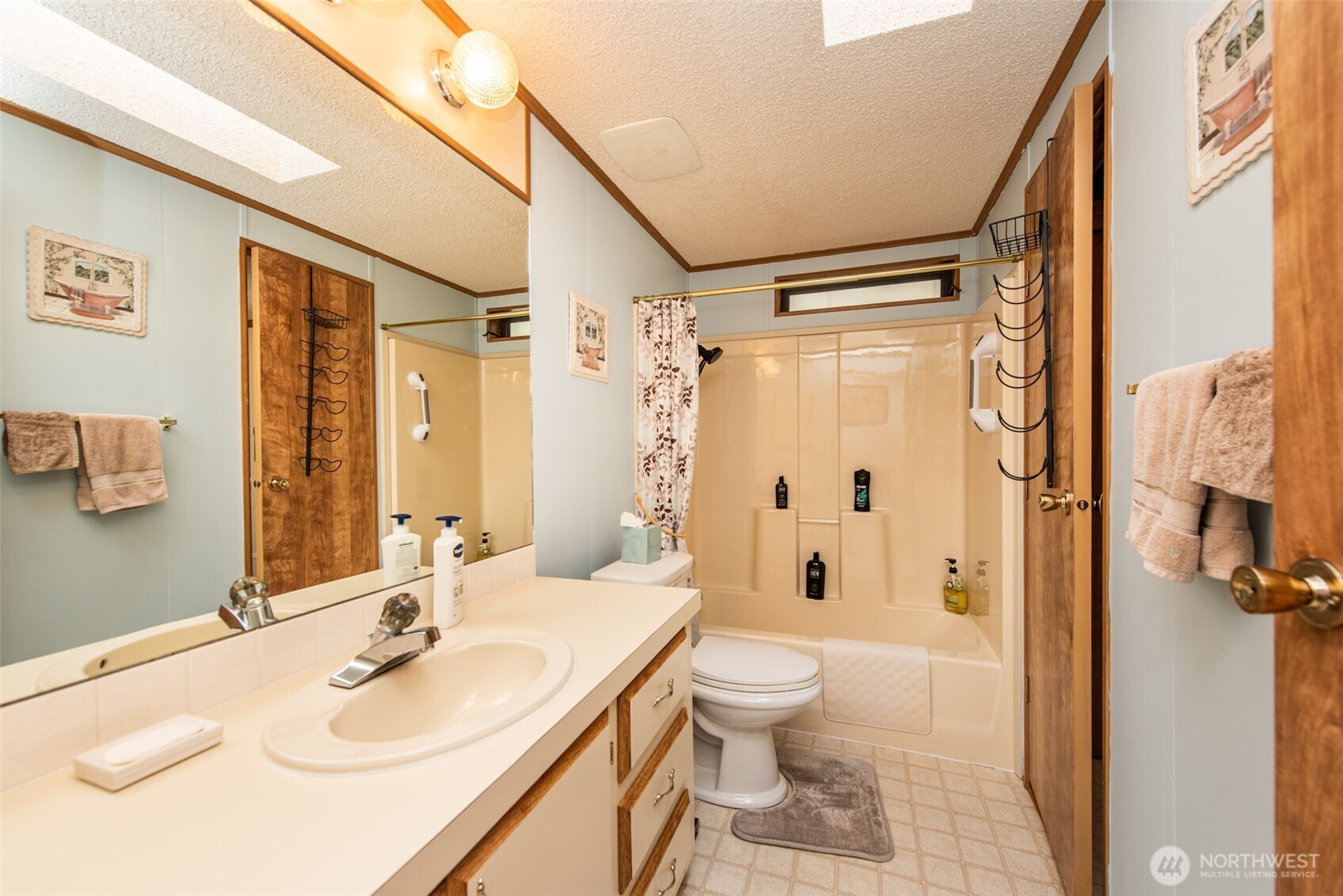 325 North 5th Avenue, Unit 48 Sequim, WA 98382 - Photo 14 of 40 a bathroom with a sink toilet and shower