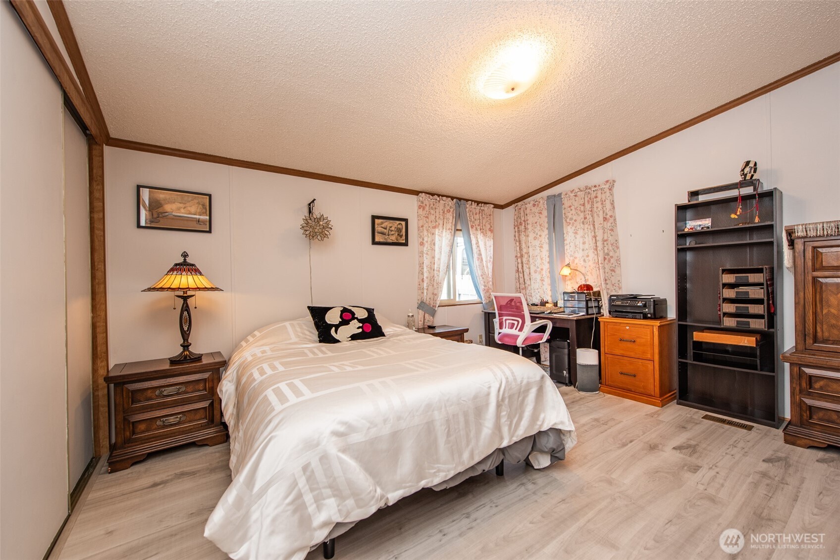 325 North 5th Avenue, Unit 48 Sequim, WA 98382 - Photo 18 of 40 a bedroom with a bed and furniture