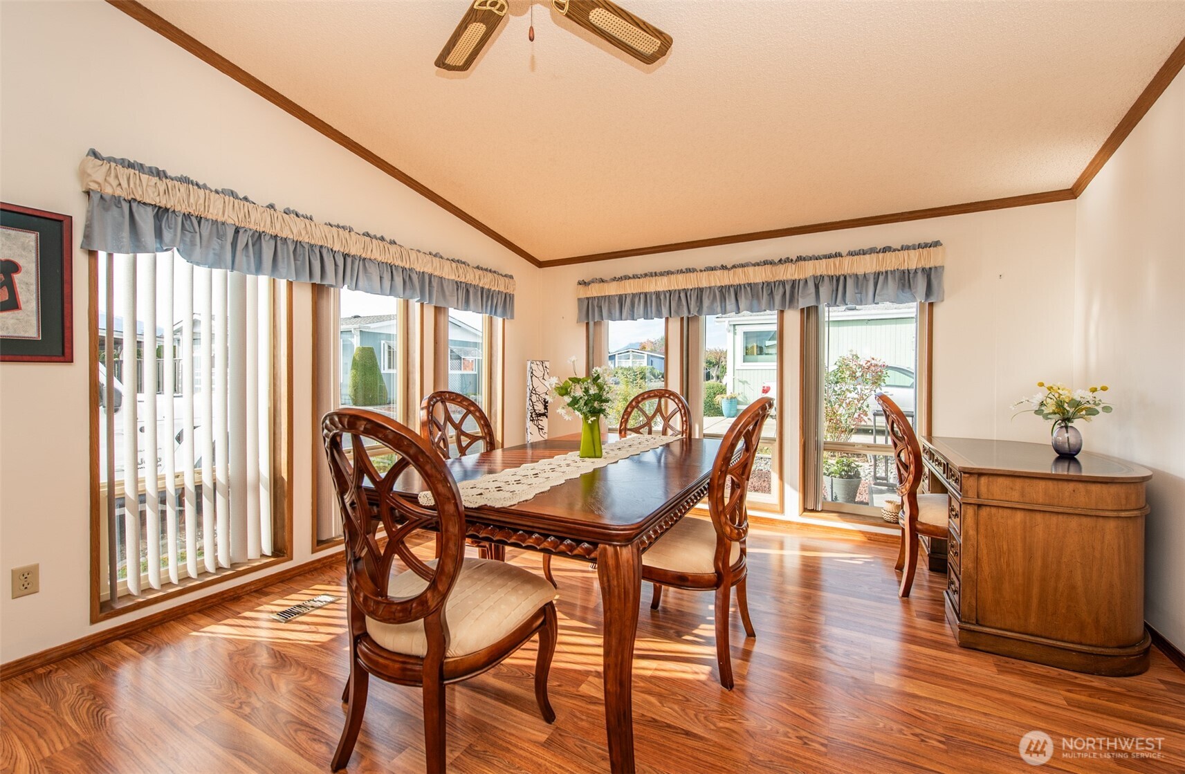 325 North 5th Avenue, Unit 48 Sequim, WA 98382 - Photo 30 of 40 a view of a dining room with furniture window and wooden floor