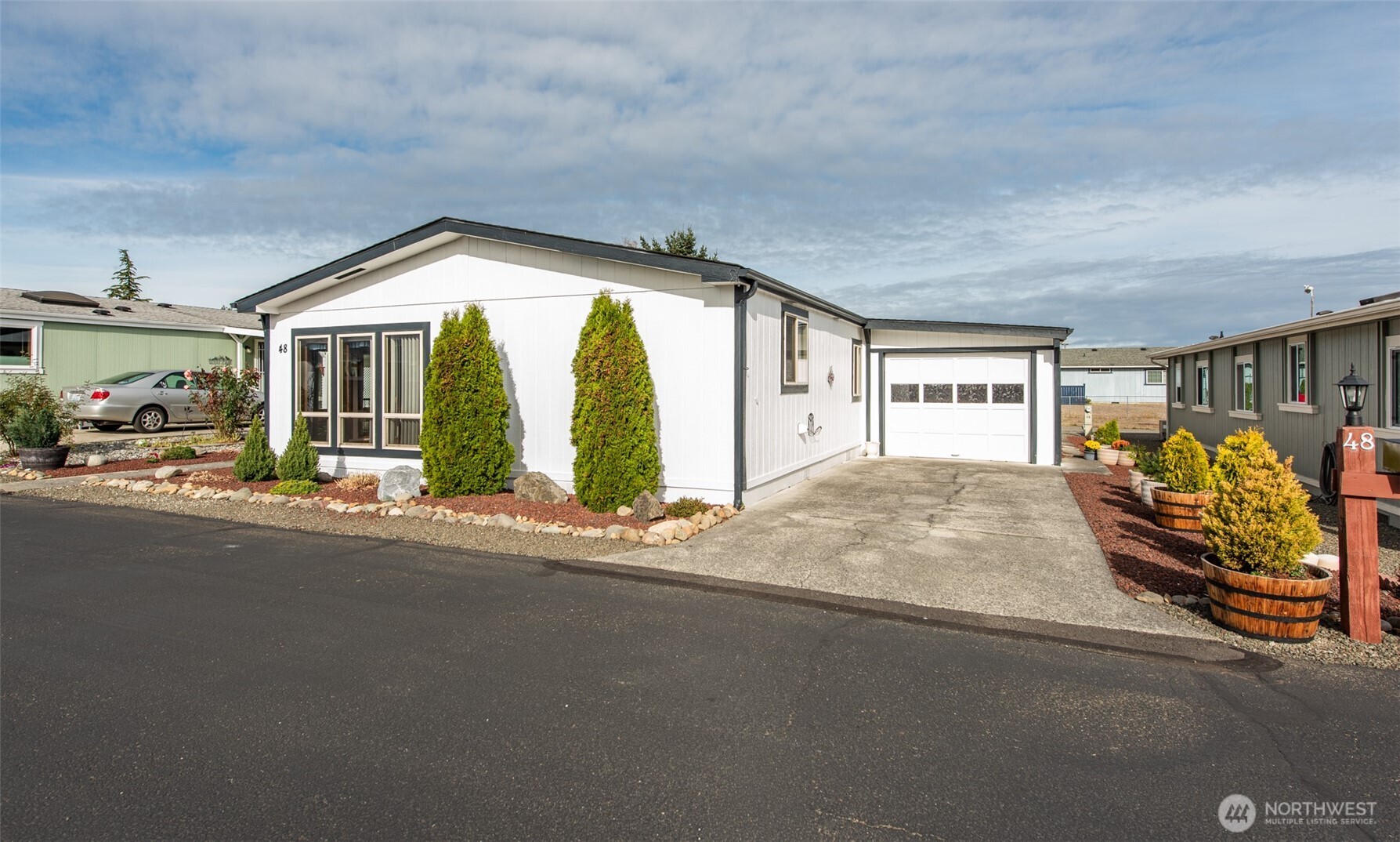 325 North 5th Avenue, Unit 48 Sequim, WA 98382 - Photo 34 of 40 a view of a house with a outdoor space and porch