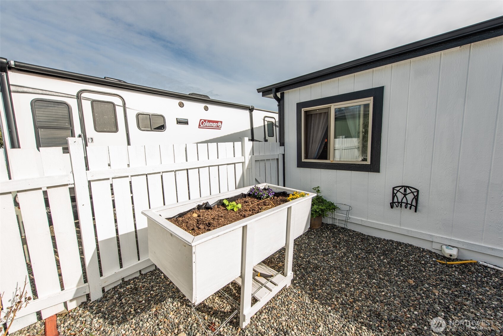 325 North 5th Avenue, Unit 48 Sequim, WA 98382 - Photo 36 of 40 a living room with a couch and a table in it