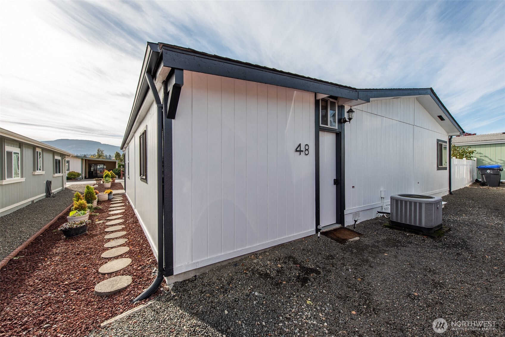 325 North 5th Avenue, Unit 48 Sequim, WA 98382 - Photo 40 of 40 a view of a house with a porch