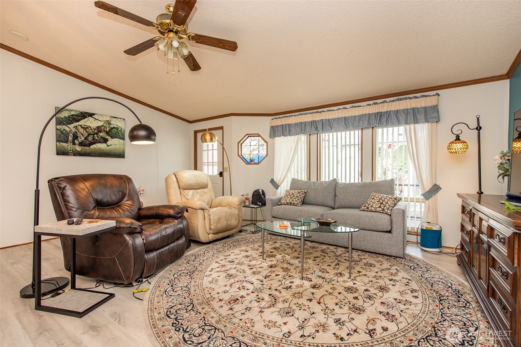 325 North 5th Avenue, Unit 48 Sequim, WA 98382 - Photo 10 of 40 a living room with furniture and a flat screen tv