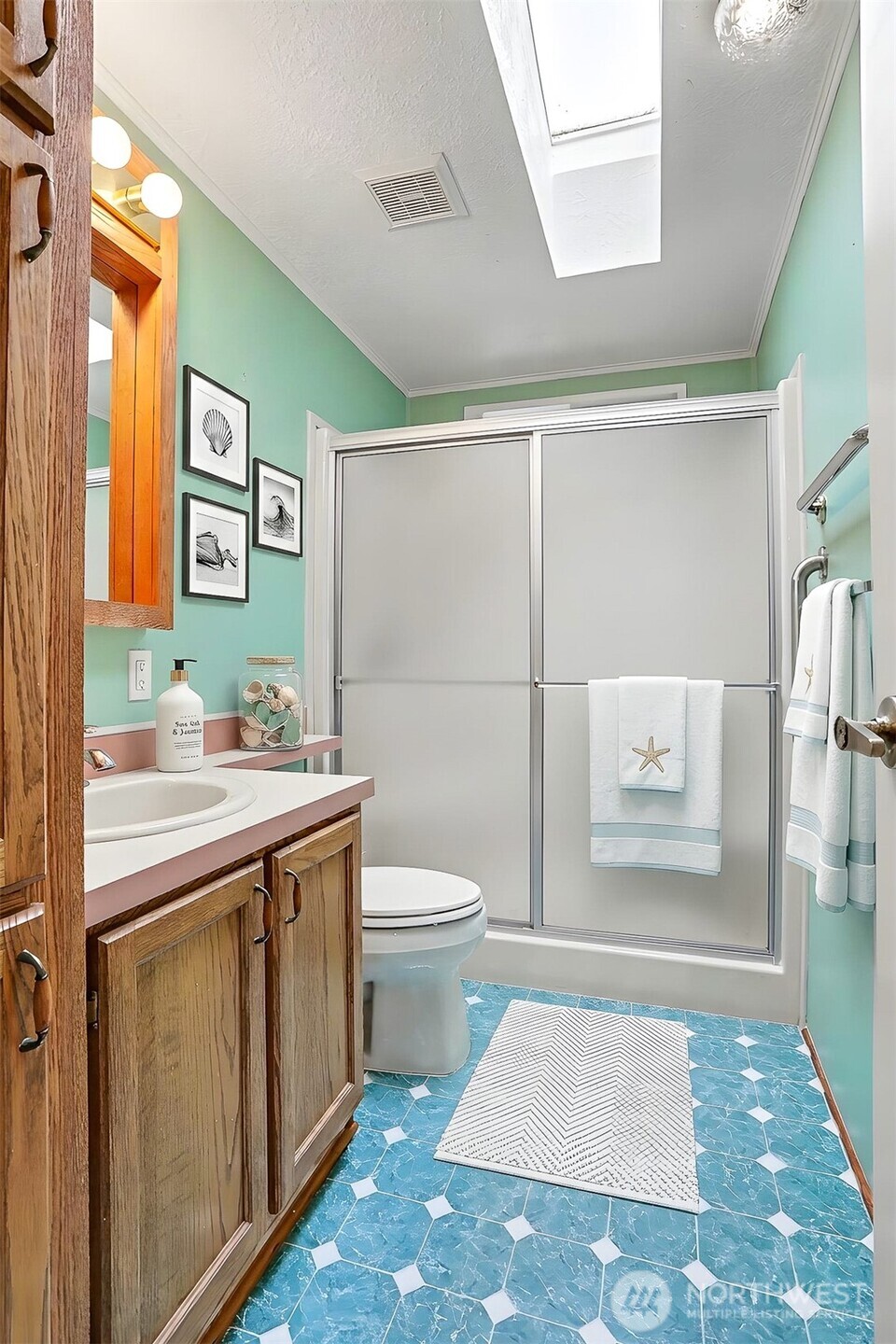905 243rd Street Southwest Bothell, WA 98021 - Photo 27 of 37 a bathroom with a granite countertop sink toilet and shower
