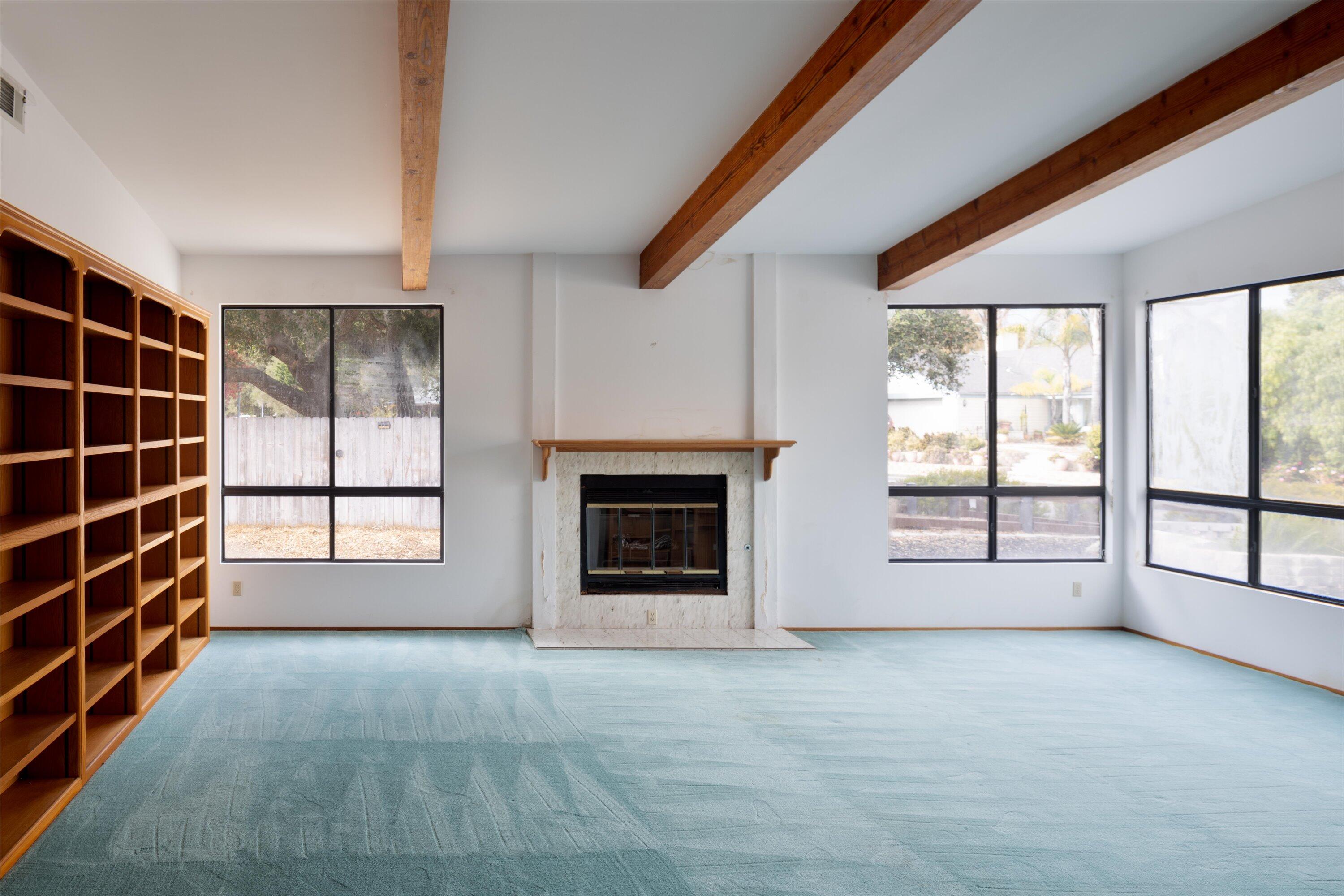 970 Onstott Road Lompoc, CA 93436 - Photo 9 of 38 a view of an empty room with a window and fireplace