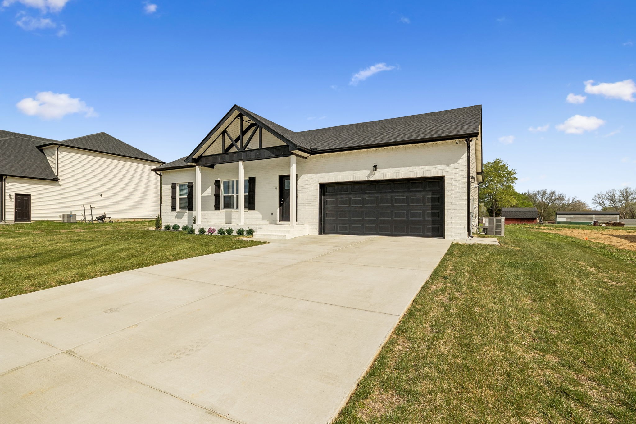 180 Vickers Hill Road Smithville, TN 37166 - Photo 3 of 33 a front view of a house with a yard