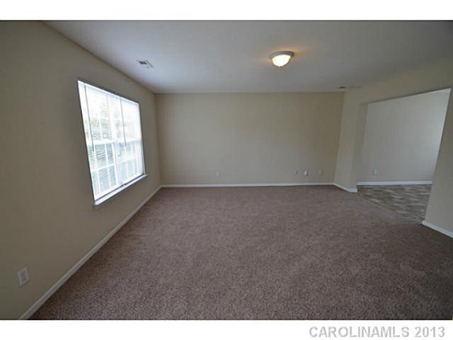6515 Sunman Road Charlotte, NC 28216 - Photo 2 of 8 a view of an empty room with a window