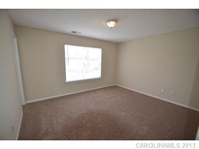 6515 Sunman Road Charlotte, NC 28216 - Photo 3 of 8 a view of an empty room with a window