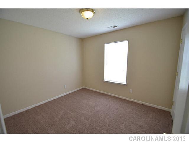 6515 Sunman Road Charlotte, NC 28216 - Photo 4 of 8 a view of an empty room with a window