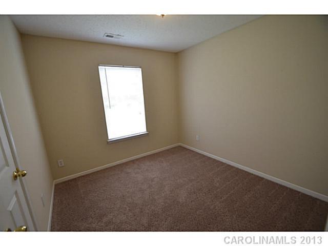 6515 Sunman Road Charlotte, NC 28216 - Photo 5 of 8 a view of a window in an empty room