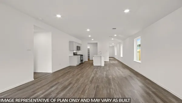 a view of a kitchen with wooden floor