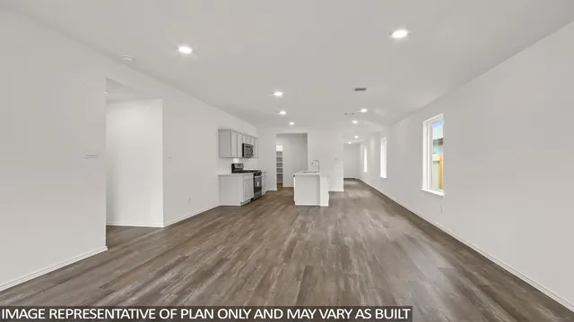 a view of a kitchen with wooden floor