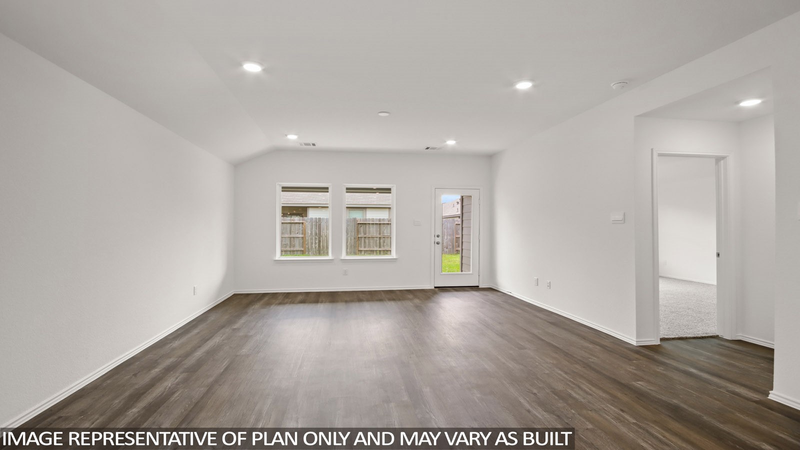1690 Portia Lane Conroe, TX 77301 - Photo 4 of 18 a view of an empty room with wooden floor and a window