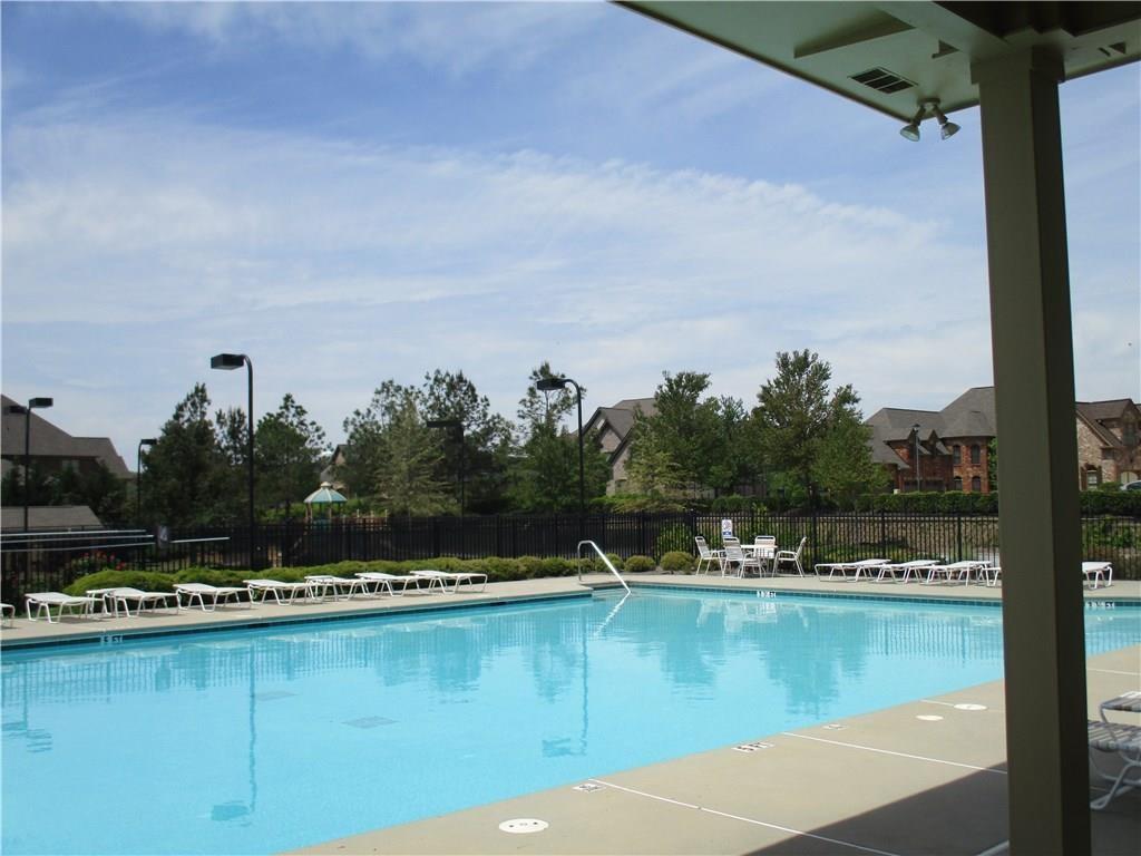 a view of a swimming pool with an outdoor seating