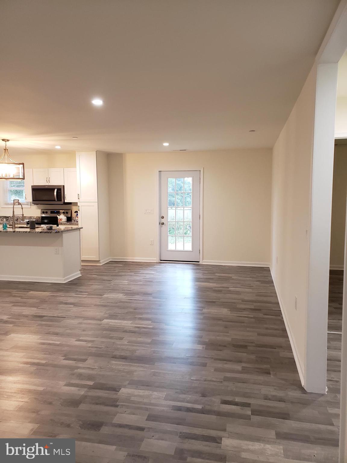 104 East 3rd Street Ridgely, MD 21660 - Photo 11 of 49 View of dining area and rear entrance door