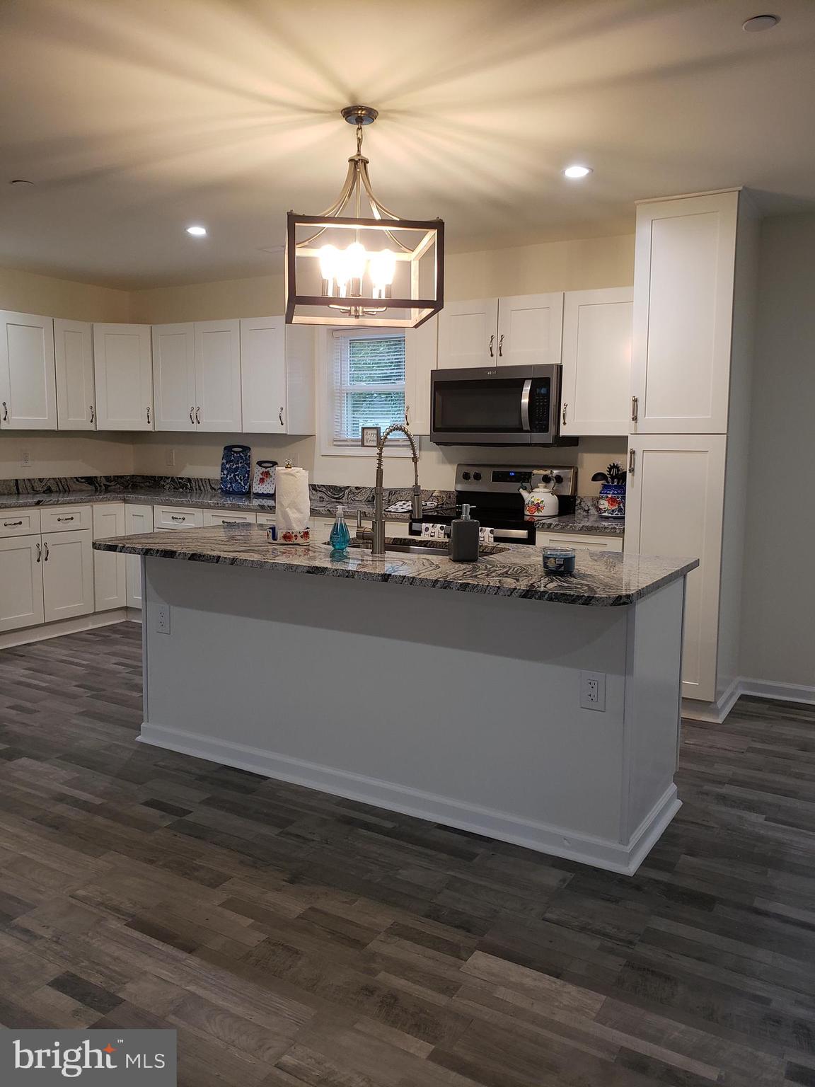 104 East 3rd Street Ridgely, MD 21660 - Photo 14 of 49 Large over 7' island, complete with deep SS sink.