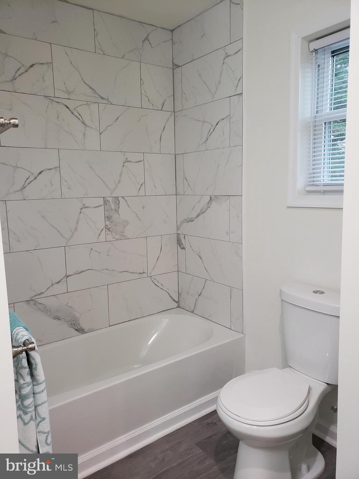 104 East 3rd Street Ridgely, MD 21660 - Photo 28 of 49 Main bath with beautiful tile tub surround.