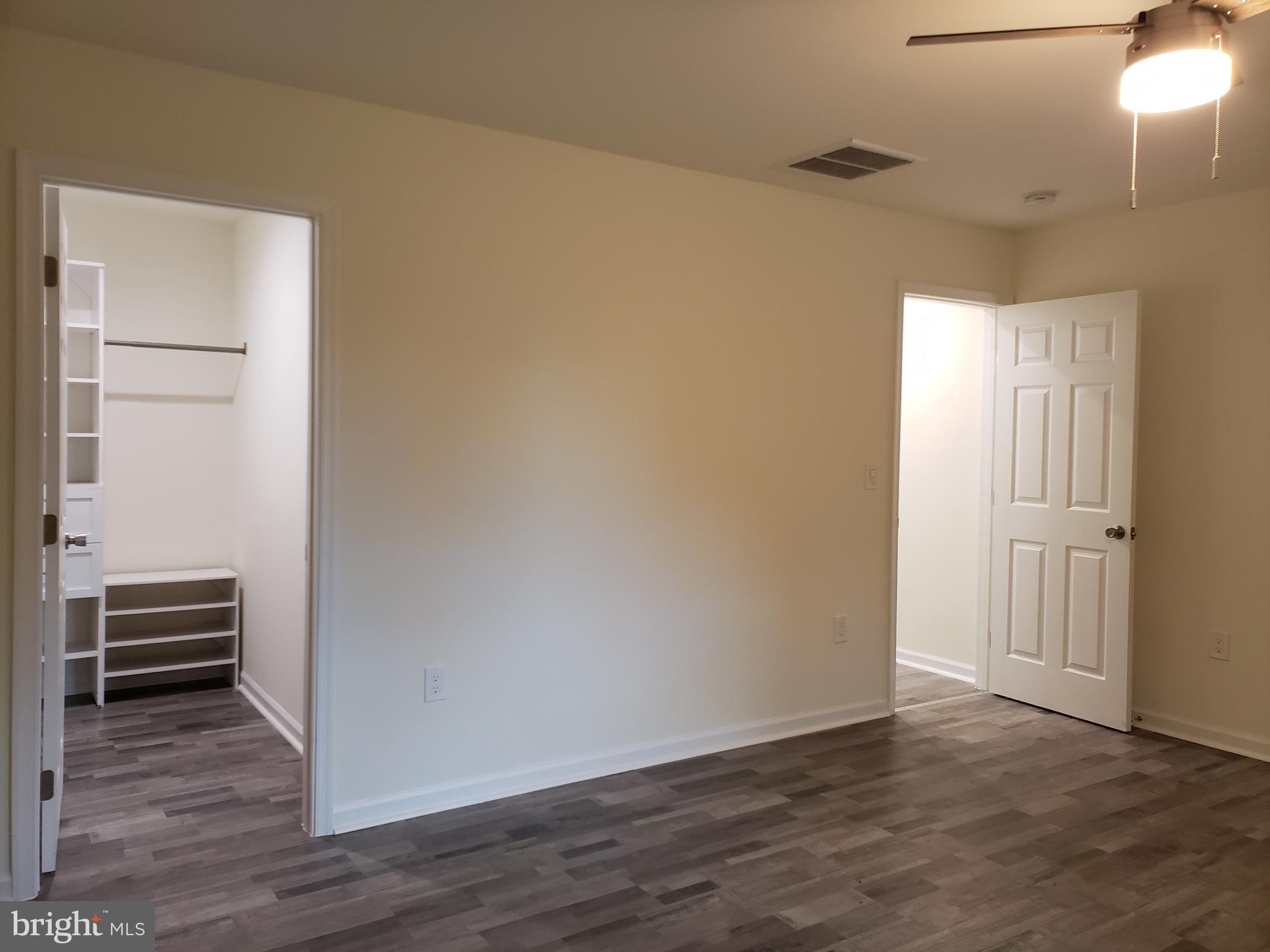 104 East 3rd Street Ridgely, MD 21660 - Photo 42 of 49 Bedroom 2 showing walk-in closet and entrance door