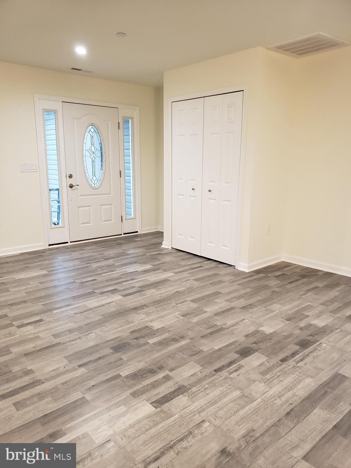 104 East 3rd Street Ridgely, MD 21660 - Photo 7 of 49 Open floor plan showing front entrance door.