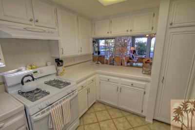28 Calle Encinitas Rancho Mirage, CA 92270 - Photo 11 of 25 a kitchen with a sink cabinets and stove