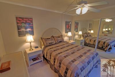28 Calle Encinitas Rancho Mirage, CA 92270 - Photo 16 of 25 a bedroom with bed and a chandelier