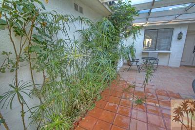 28 Calle Encinitas Rancho Mirage, CA 92270 - Photo 20 of 25 a view of backyard with a table and chairs and potted plants