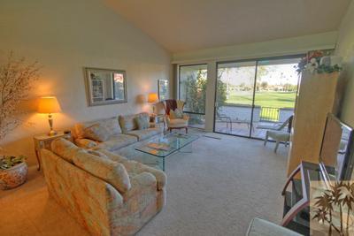 28 Calle Encinitas Rancho Mirage, CA 92270 - Photo 2 of 25 a living room with furniture and a floor to ceiling window
