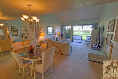 28 Calle Encinitas Rancho Mirage, CA 92270 - Photo 6 of 25 a view of a dining room with furniture a chandelier and large windows