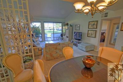 28 Calle Encinitas Rancho Mirage, CA 92270 - Photo 7 of 25 a living room with patio chairs and a chandelier